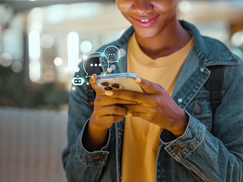 Person smiling while using a smartphone